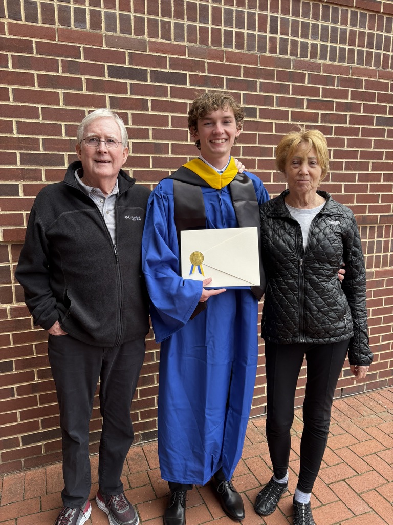 The founder of Sollund standing with his grandfather and grandmother at his graduation.